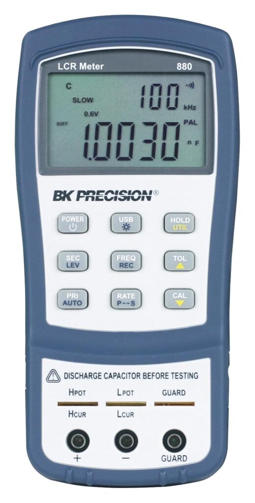 B&K Precision 880 Handheld LCR Meter with dual high-resolution display, used for measuring inductance, capacitance, resistance, and impedance in physics and electronics labs